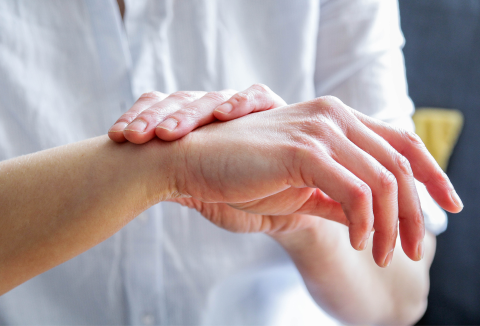 person putting cream on hands