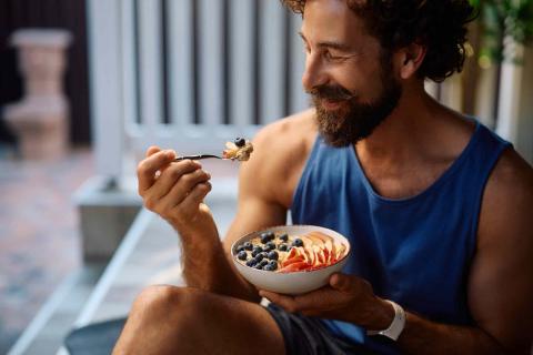 Man with healthy hair eating healthy food